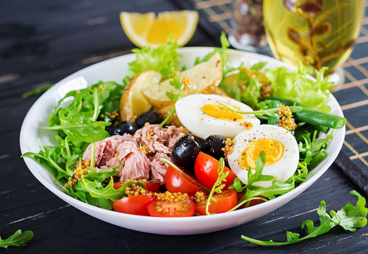 healthy-hearty-salad-tuna-green-beans-tomatoes-eggs-potatoes-black-olives-close-up-bowl-table_2829-4485